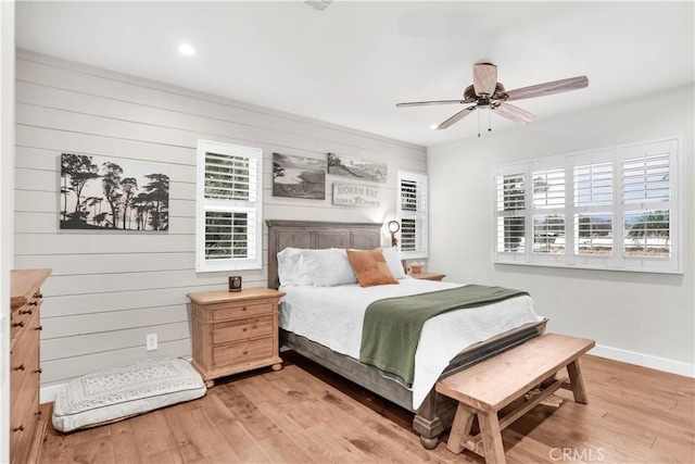 32811 Wesley St, Wildomar, CA 92595 - bedroom with light wood-style floors, baseboards, recessed lighting, a ceiling fan, and wood walls