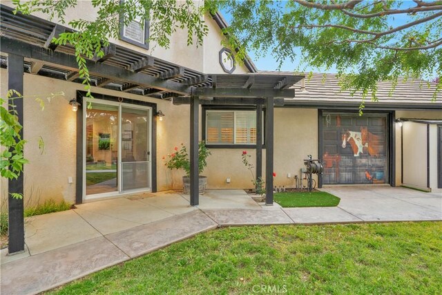 32811 Wesley St, Wildomar, CA 92595 - back of property featuring stucco siding, a pergola, a patio, and a yard