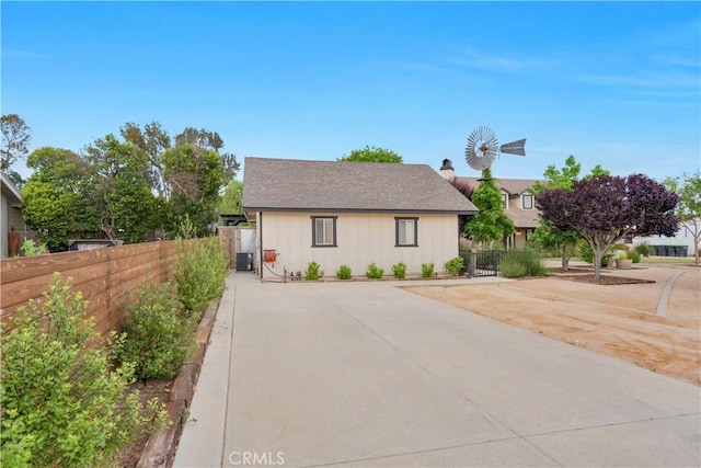 32811 Wesley St, Wildomar, CA 92595 - view of front of property featuring board and batten siding, central air condition unit, and a gate