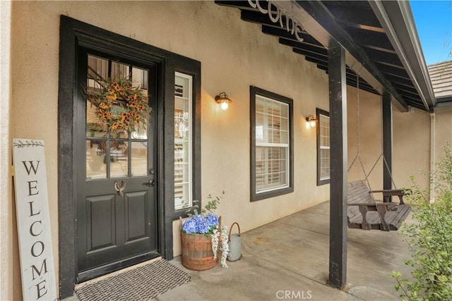 32811 Wesley St, Wildomar, CA 92595 - view of exterior entry featuring covered porch and stucco siding