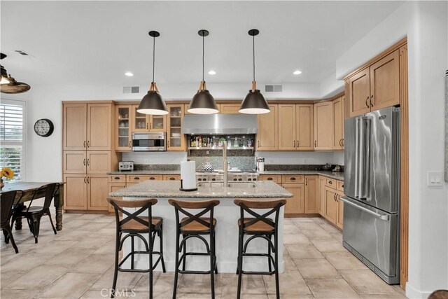 32811 Wesley St, Wildomar, CA 92595 - kitchen with stainless steel appliances, range hood, a kitchen island with sink, a breakfast bar, and glass insert cabinets