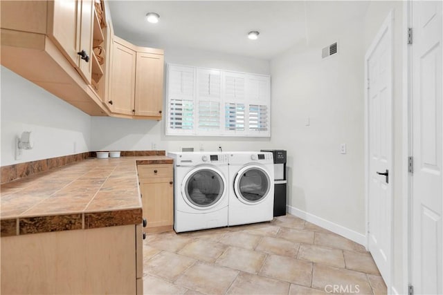 32811 Wesley St, Wildomar, CA 92595 - washroom with washing machine and clothes dryer, cabinet space, and baseboards