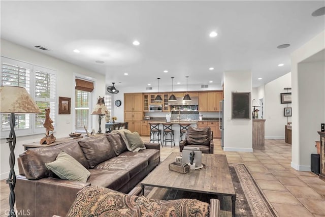 32811 Wesley St, Wildomar, CA 92595 - living room featuring baseboards and recessed lighting