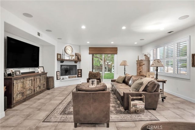 32811 Wesley St, Wildomar, CA 92595 - living room with recessed lighting, a glass covered fireplace, and baseboards