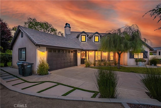 32811 Wesley St, Wildomar, CA 92595 - view of front of property featuring a chimney, an attached garage, stucco siding, and concrete driveway