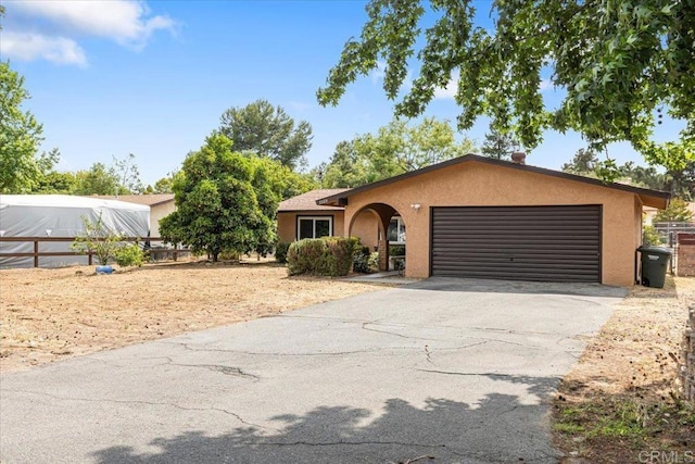 1105 Via Prado, Fallbrook, CA 92028 - ranch-style house featuring stucco siding, an attached garage, and driveway