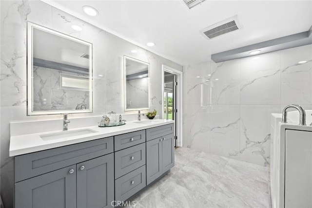 1020 S Montezuma Way, West Covina, CA 91791 - full bathroom featuring double vanity, marble tiled flooring, healthy amount of natural light, and recessed lighting
