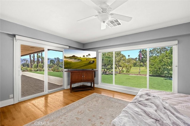 1020 S Montezuma Way, West Covina, CA 91791 - bedroom featuring access to exterior, wood finished floors, and multiple windows