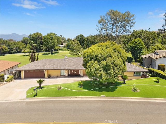 1020 S Montezuma Way, West Covina, CA 91791 - ranch-style home featuring driveway, a garage, a front lawn, view of wooded area, and a mountain view