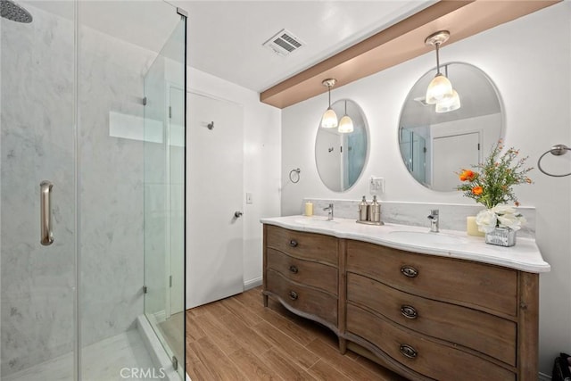 1020 S Montezuma Way, West Covina, CA 91791 - bathroom with wood finished floors, double vanity, and a shower stall