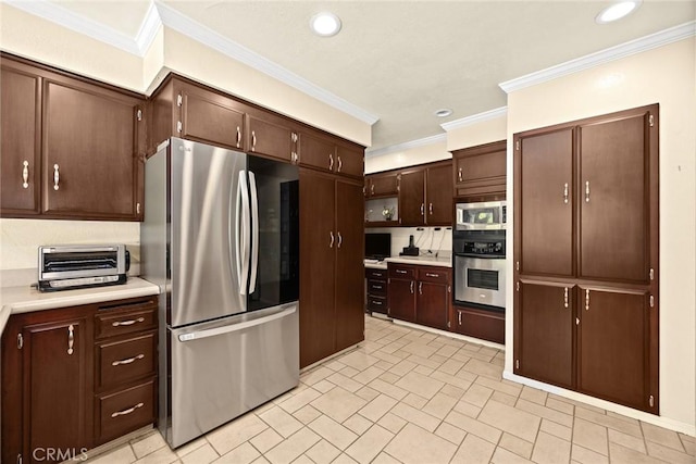 1020 S Montezuma Way, West Covina, CA 91791 - kitchen featuring stainless steel appliances, ornamental molding, light countertops, dark brown cabinetry, and recessed lighting