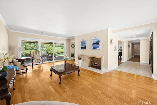 1020 S Montezuma Way, West Covina, CA 91791 - living room with a fireplace with flush hearth, wood finished floors, and ornamental molding