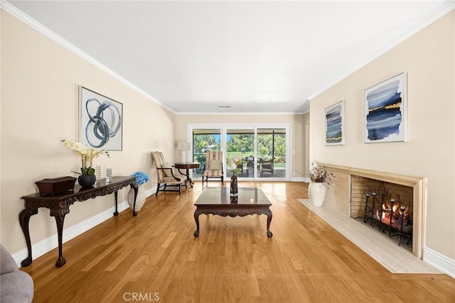 1020 S Montezuma Way, West Covina, CA 91791 - living area featuring a fireplace with flush hearth, crown molding, and light wood-style floors
