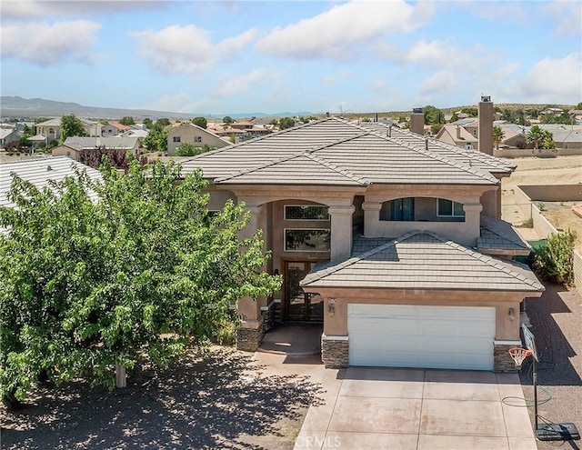26775 Lakeview, Helendale, CA 92342 - view of front facade with stucco siding, driveway, a garage, a chimney, and a tile roof