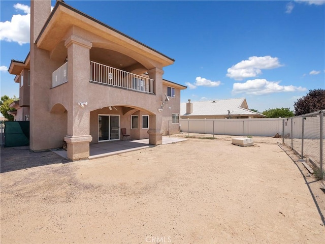 26775 Lakeview, Helendale, CA 92342 - back of property with a balcony, stucco siding, a patio, and a fenced backyard