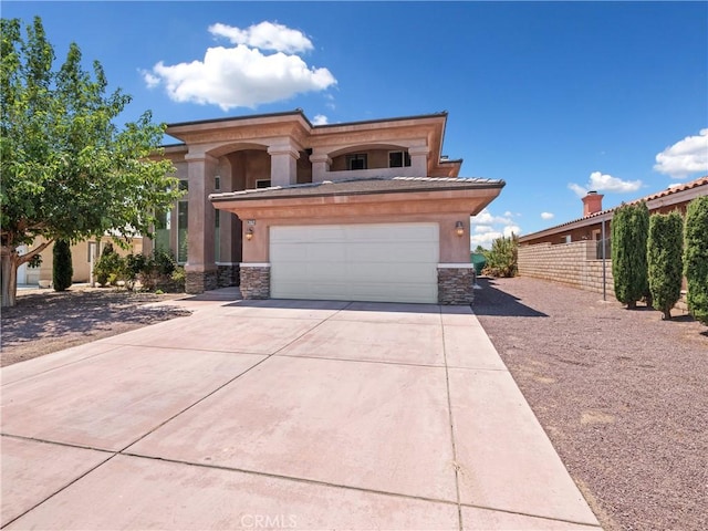 26775 Lakeview, Helendale, CA 92342 - view of front of property with stone siding, concrete driveway, stucco siding, and an attached garage