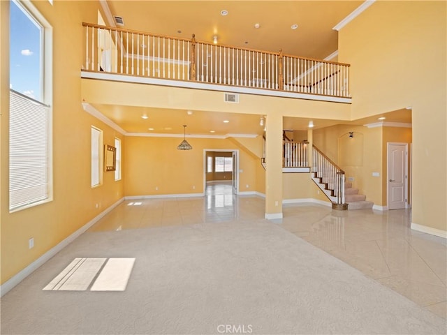 26775 Lakeview, Helendale, CA 92342 - unfurnished living room featuring a high ceiling, baseboards, ornamental molding, stairs, and tile patterned floors