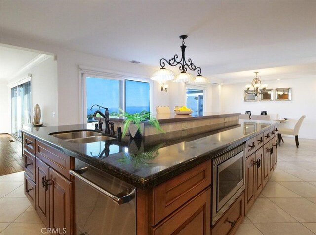 3226 Corinna Dr, Rancho Palos Verdes, CA 90275 - kitchen with appliances with stainless steel finishes, a sink, a chandelier, light tile patterned flooring, and plenty of natural light