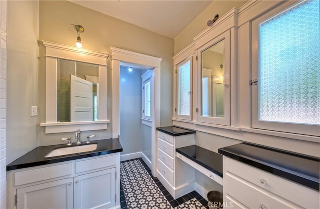 208 Highland Pl, Monrovia, CA 91016 - bathroom featuring vanity, a bath, and baseboards