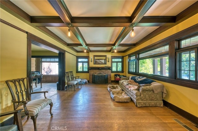 208 Highland Pl, Monrovia, CA 91016 - living room with coffered ceiling, wood finished floors, beamed ceiling, and a brick fireplace
