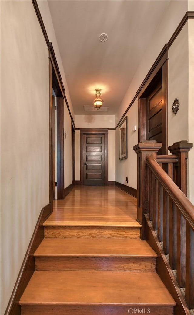 208 Highland Pl, Monrovia, CA 91016 - stairway featuring wood finished floors and baseboards