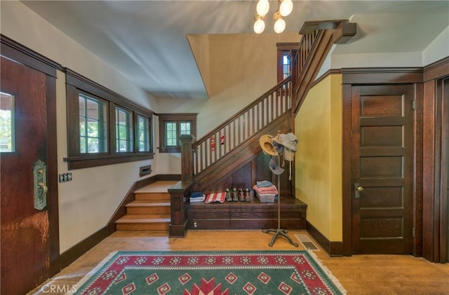 208 Highland Pl, Monrovia, CA 91016 - entryway with stairway, wood finished floors, baseboards, and a chandelier