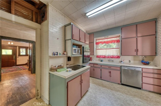 208 Highland Pl, Monrovia, CA 91016 - kitchen featuring black appliances, light countertops, a sink, and healthy amount of natural light