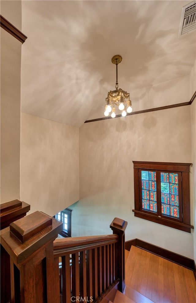 208 Highland Pl, Monrovia, CA 91016 - stairway with a chandelier, hardwood / wood-style floors, and vaulted ceiling
