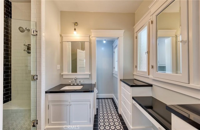 208 Highland Pl, Monrovia, CA 91016 - full bathroom featuring a shower stall, vanity, baseboards, and toilet