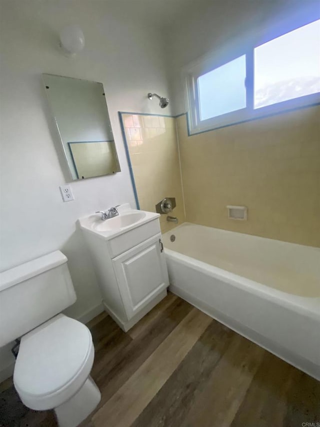 481848321/2 Palm Ave, La Mesa, CA 91942 - bathroom featuring toilet, wood finished floors, vanity, and washtub / shower combination
