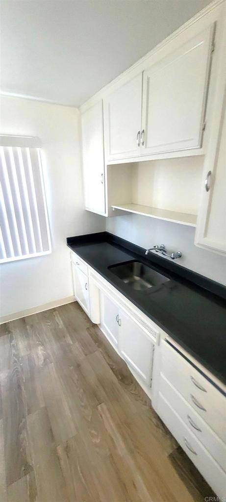 481848321/2 Palm Ave, La Mesa, CA 91942 - mudroom featuring a sink and dark wood-style flooring