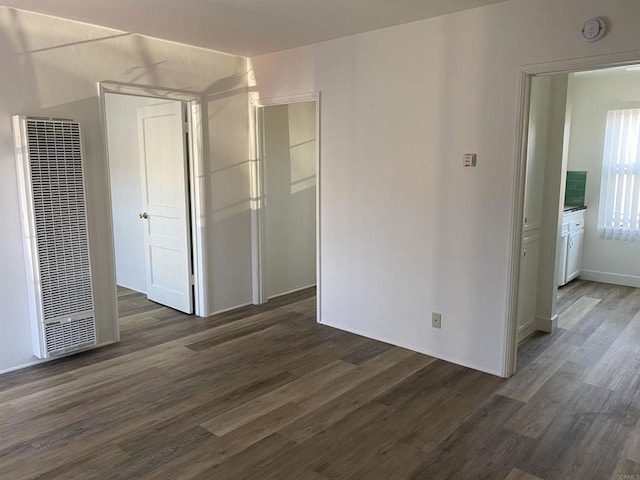 481848321/2 Palm Ave, La Mesa, CA 91942 - unfurnished bedroom with a heating unit, dark wood-style floors, and baseboards