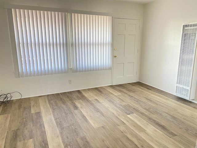 481848321/2 Palm Ave, La Mesa, CA 91942 - unfurnished room with a heating unit and wood finished floors