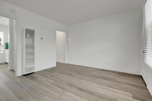 481848321/2 Palm Ave, La Mesa, CA 91942 - spare room featuring a heating unit, light wood finished floors, baseboards, and a smoke detector