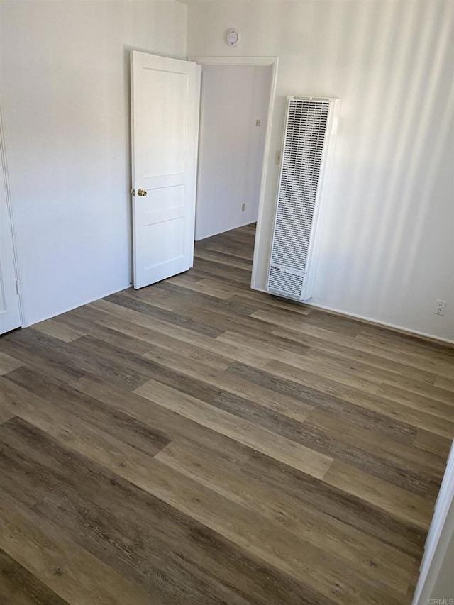 481848321/2 Palm Ave, La Mesa, CA 91942 - empty room with a heating unit, dark wood-style floors, and a smoke detector