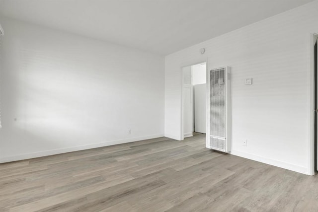 481848321/2 Palm Ave, La Mesa, CA 91942 - unfurnished bedroom featuring a heating unit, wood finished floors, and baseboards