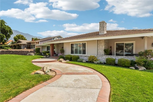 1926 N Vallejo Way, Upland, CA 91784 - view of front of home featuring a chimney, stucco siding, a front yard, and covered porch