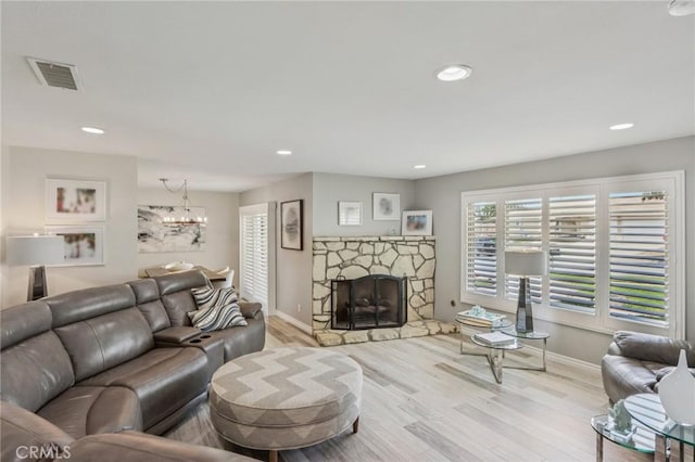 1926 N Vallejo Way, Upland, CA 91784 - living area with wood finished floors, baseboards, a chandelier, recessed lighting, and a fireplace