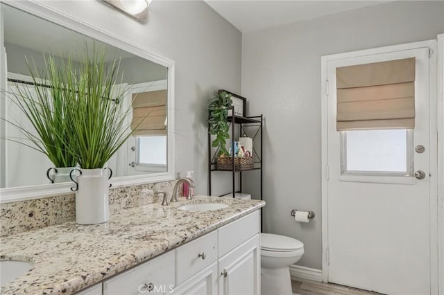 1926 N Vallejo Way, Upland, CA 91784 - full bathroom with double vanity, healthy amount of natural light, and toilet