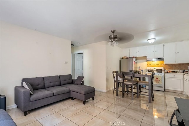 4810 N Vincent Ave, Covina, CA 91722 - living area with light tile patterned floors, ceiling fan, and baseboards