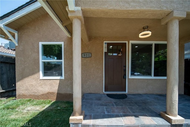 921 W 19th St, Merced, CA 95340 - doorway to property featuring stucco siding