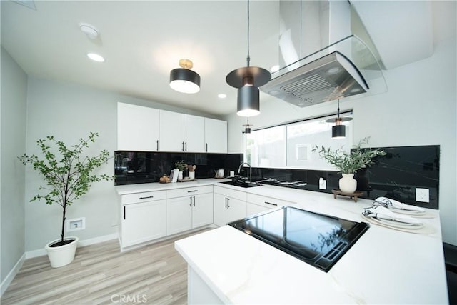 921 W 19th St, Merced, CA 95340 - kitchen featuring tasteful backsplash, white cabinets, light wood-style flooring, light countertops, and recessed lighting