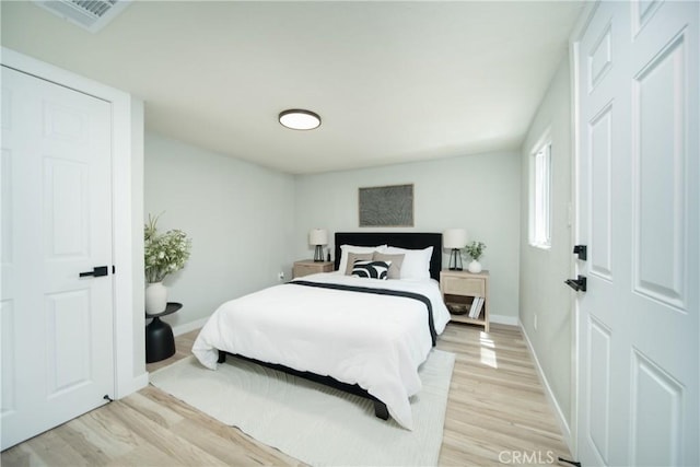 921 W 19th St, Merced, CA 95340 - bedroom with light wood finished floors and baseboards