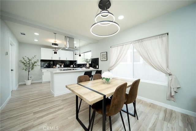 921 W 19th St, Merced, CA 95340 - dining area with light wood finished floors and recessed lighting