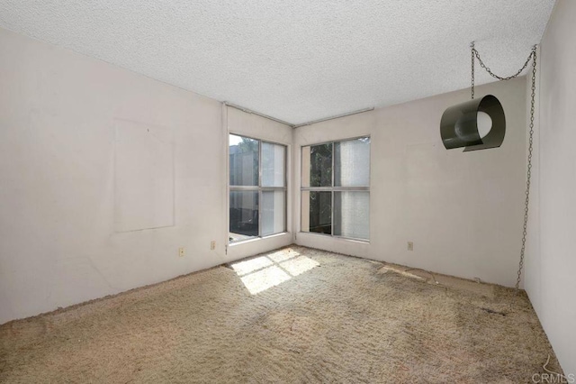 3213 Raintree Cir, Culver City, CA 90230 - empty room featuring carpet floors and a textured ceiling