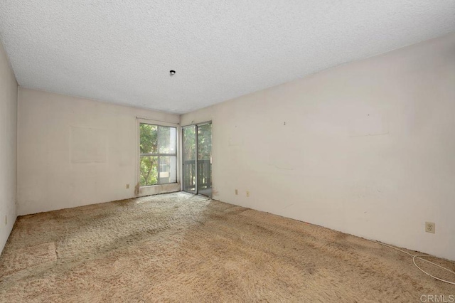 3213 Raintree Cir, Culver City, CA 90230 - carpeted empty room with a textured ceiling