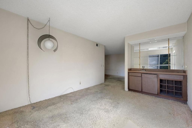 3213 Raintree Cir, Culver City, CA 90230 - unfurnished living room featuring carpet and a sink