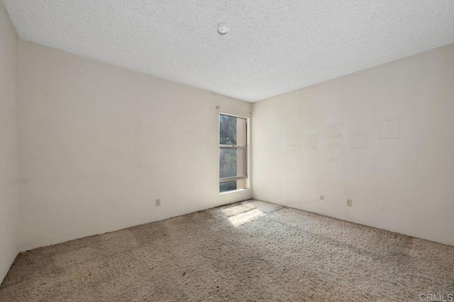 3213 Raintree Cir, Culver City, CA 90230 - carpeted spare room with a textured ceiling and a smoke detector