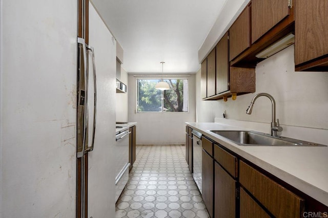 3213 Raintree Cir, Culver City, CA 90230 - kitchen featuring a sink, light countertops, stove, and light floors
