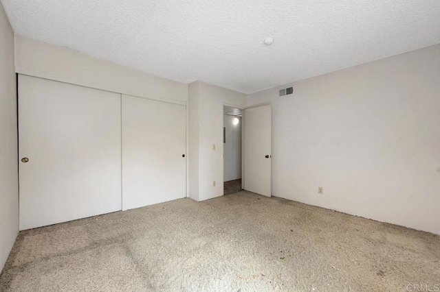 3213 Raintree Cir, Culver City, CA 90230 - unfurnished bedroom with carpet, a closet, and a textured ceiling